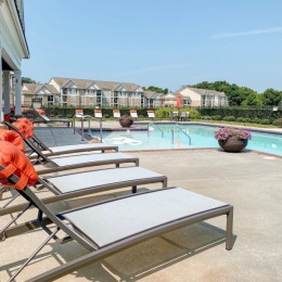 Resort-style swimming pool with lounge seating
