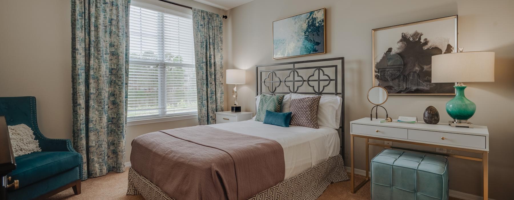 a bedroom with a bed and a chair